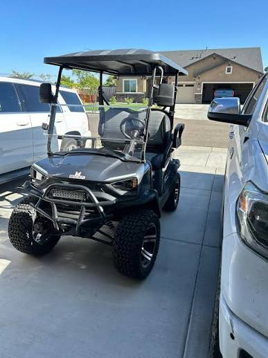 2024 Racka RGC1 — charcoal, parked in a driveway, front three-quarter